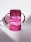 Pink water bottle sippy cup  with handles on a white background